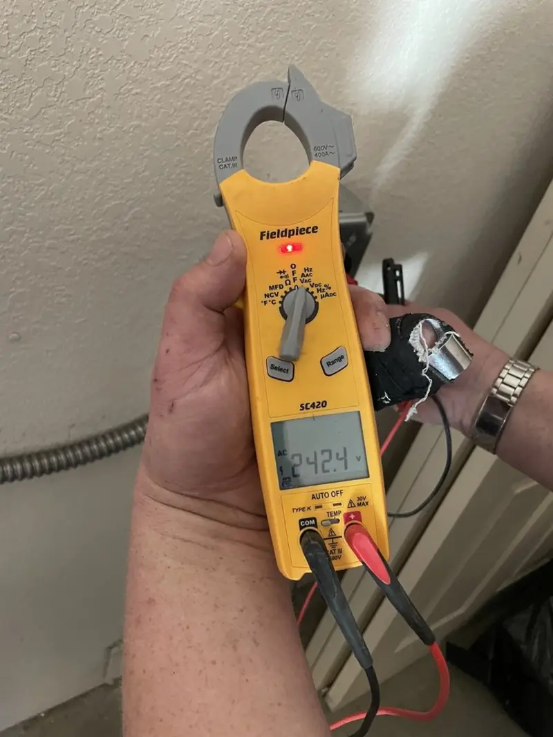Voltage testing with clamp meter during Outlet Installation in Somerville